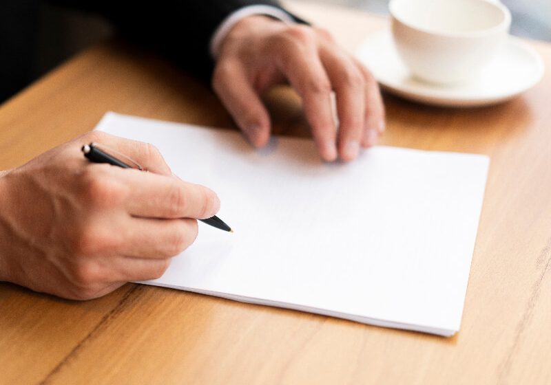 Modern corporate man taking notes